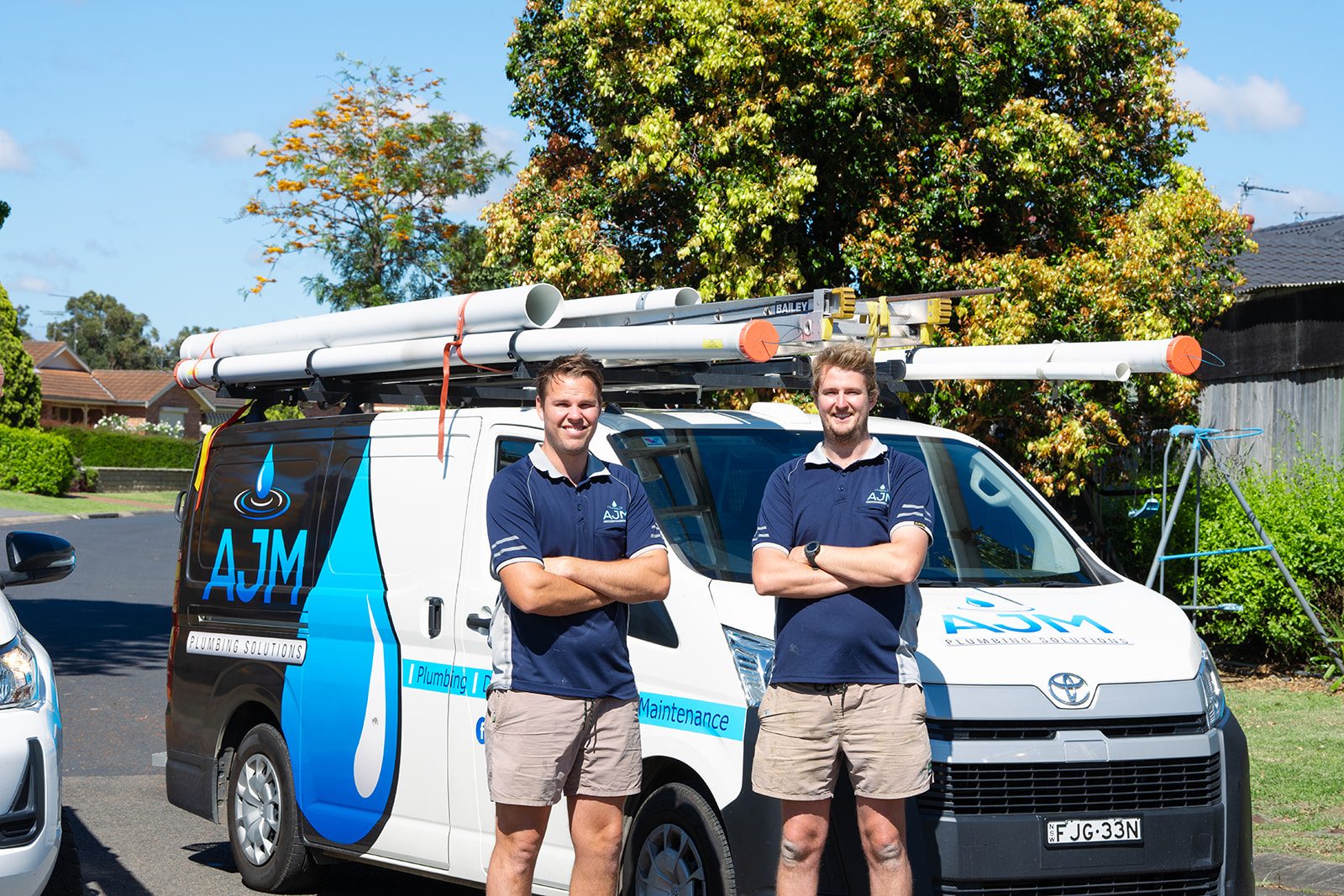 The AJM team with the vans