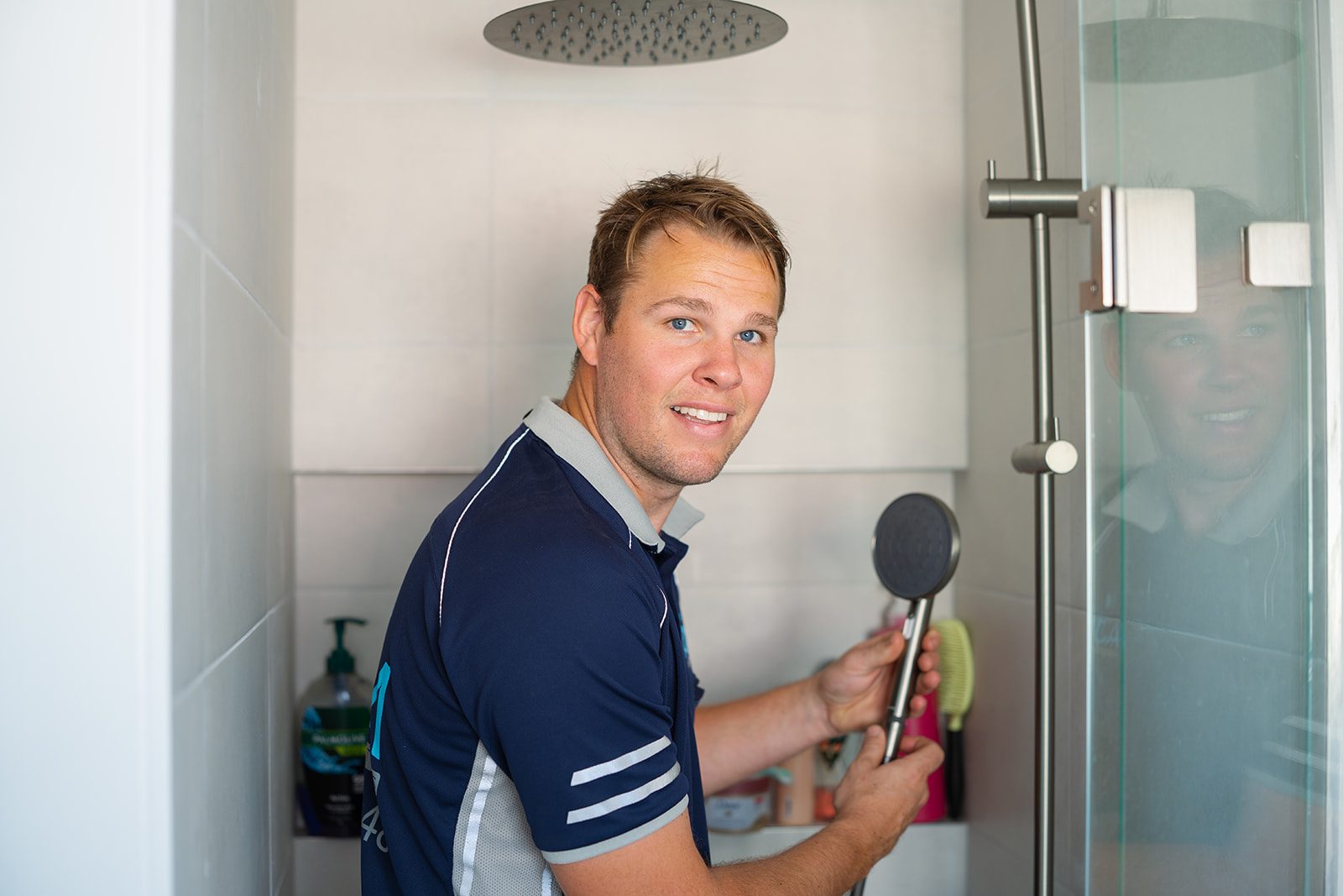 Aaron fitting a shower rail